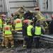 Rescue crews pull back the roof of the vehicle which was pinned under the trailer and against the guardrail. The driver of the vehicle was confirmed dead.  Melanie Maxwell I AnnArbor.com